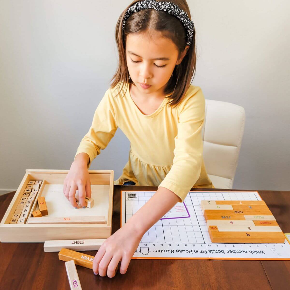 Girl Playing with Number Bonds Wooden Math Game by Little Bud Kids