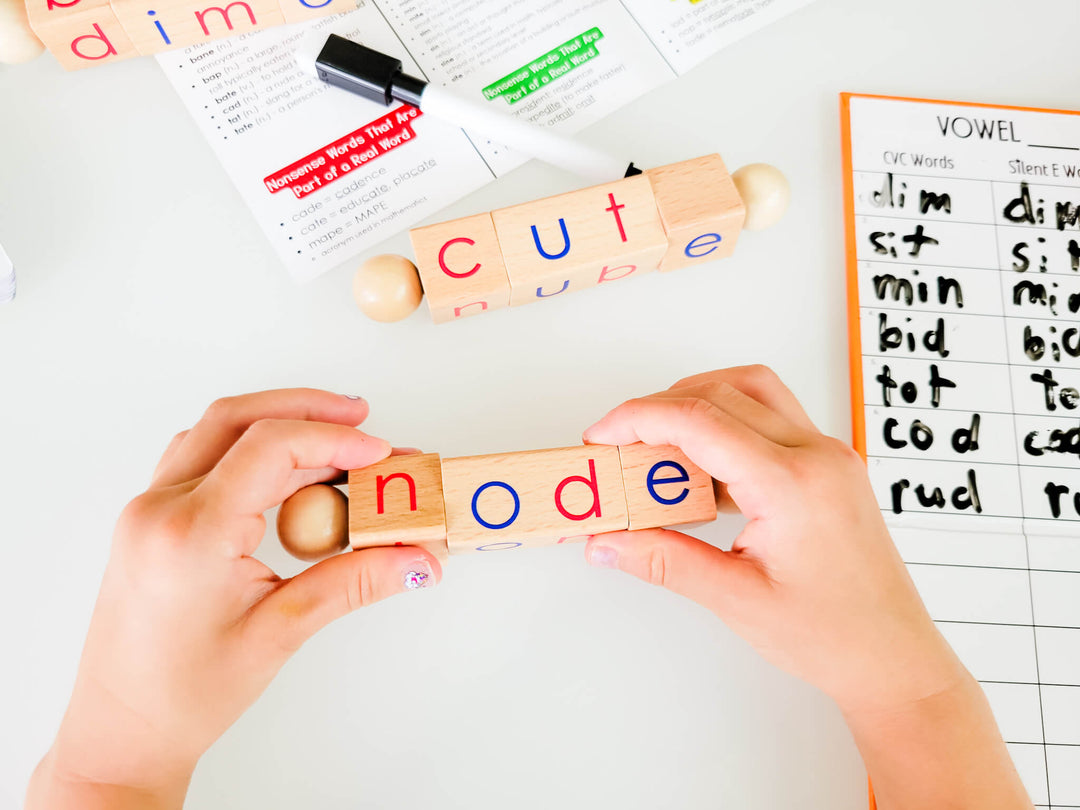 Hands-on silent E phonics activity with rotating wooden blocks forming words like node and cute, plus vowel worksheet for teaching CVC and CVCe word transformation, spelling practice, and long vowel recognition.