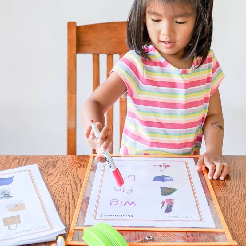 Girl using Little Bud Kids CVC Worksheet Set 
