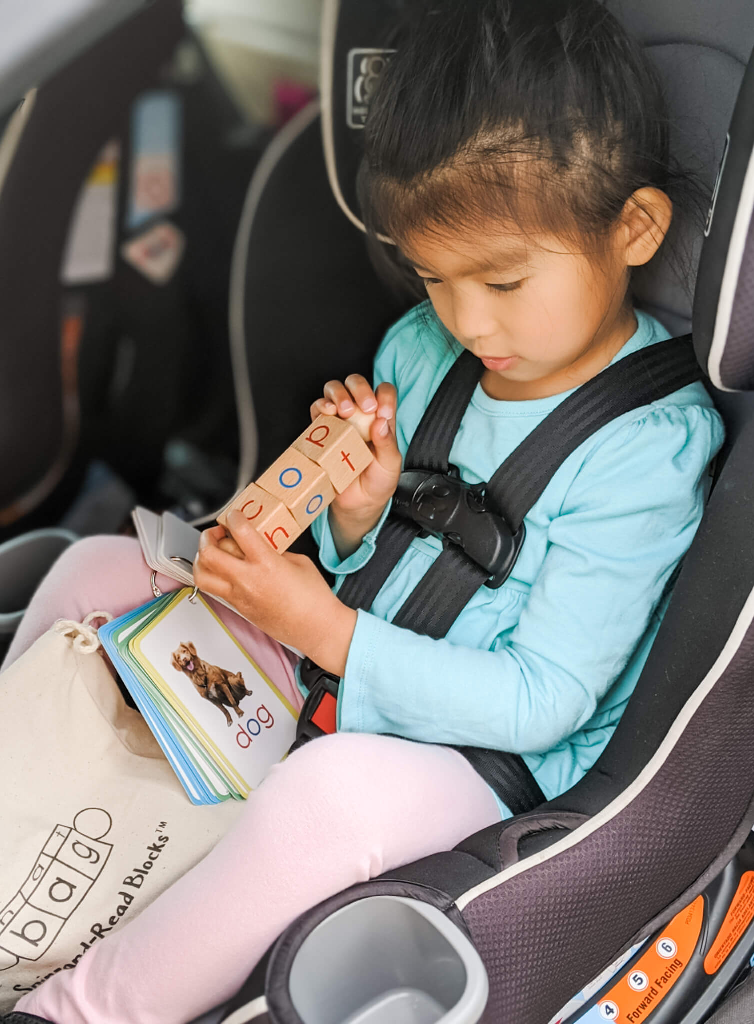 Girl learning reading- travel toy - phonics 