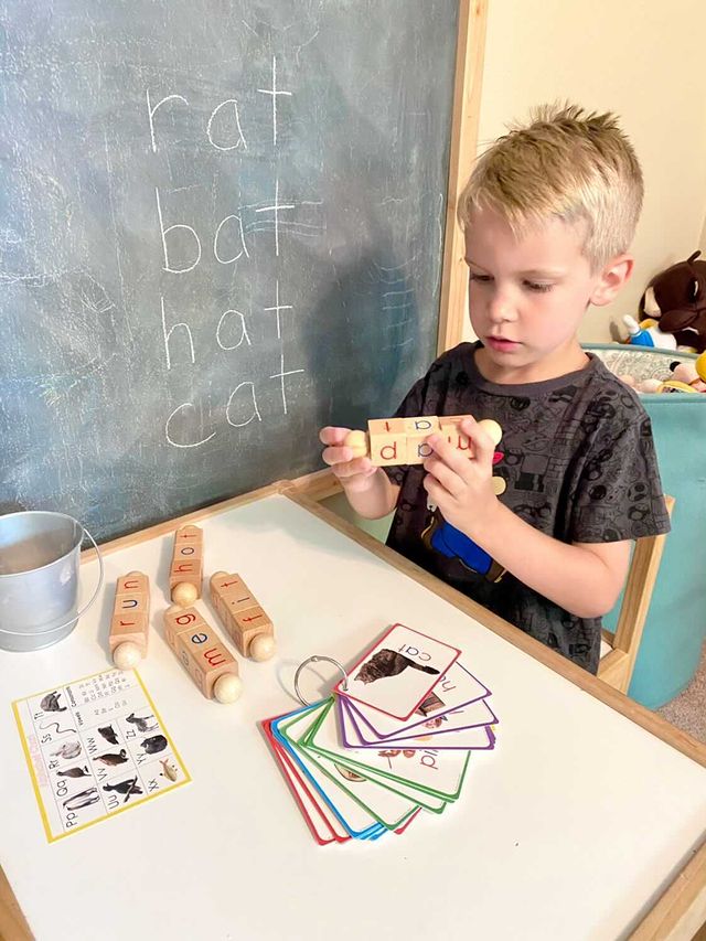 Boy using Movable CVC Phonetic Blocks - Little Bud Kids
