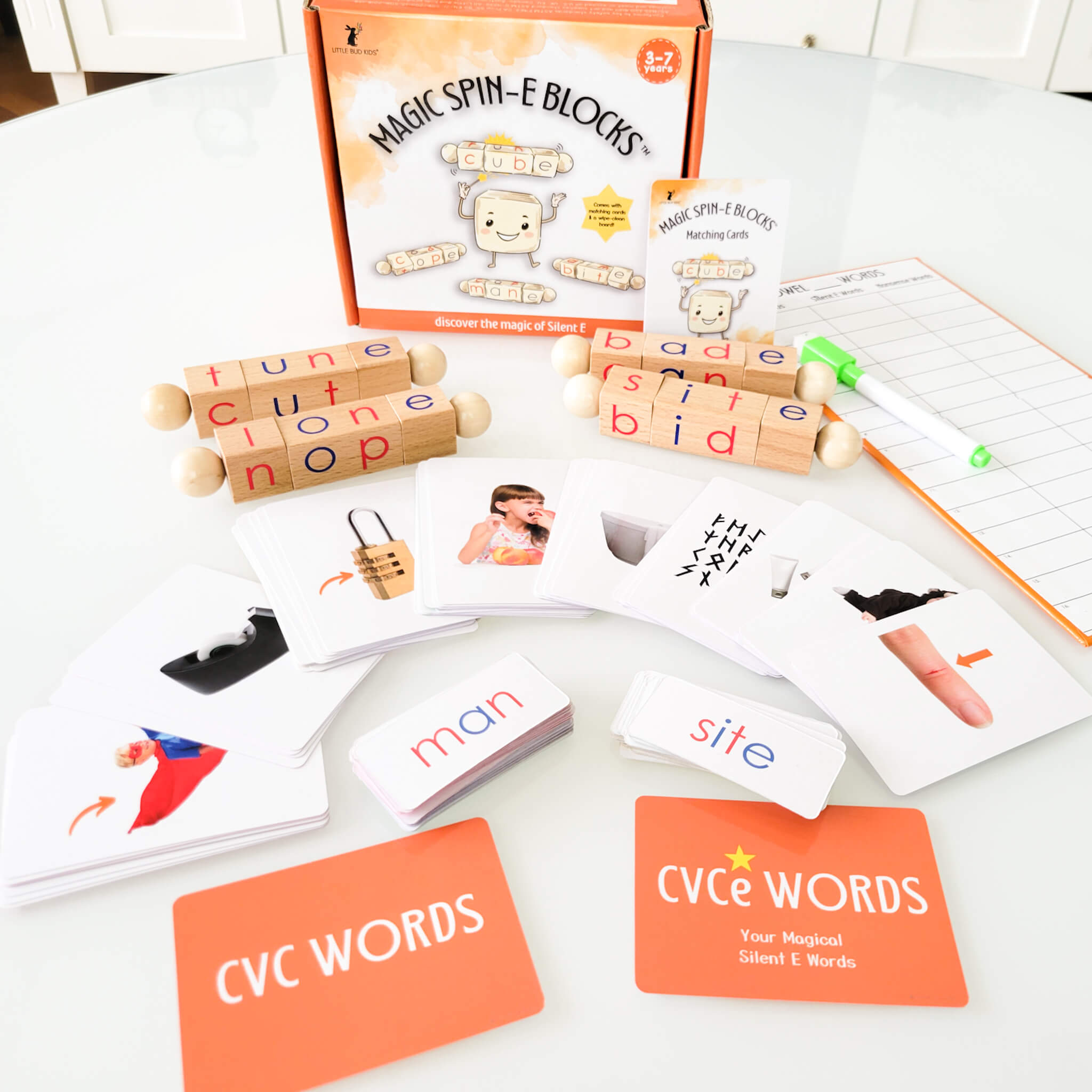 Silent E phonics learning kit for kids ages 3–7 featuring Magic Spin-E Blocks, CVC to CVCe word flashcards, dry-erase board, and interactive literacy tools for teaching long vowels and word transformation.